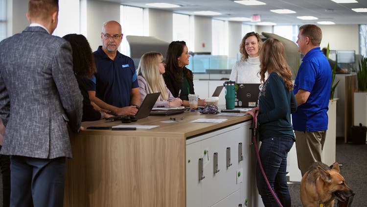 People in office working and talking
