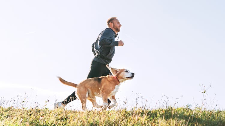 Man running with dog