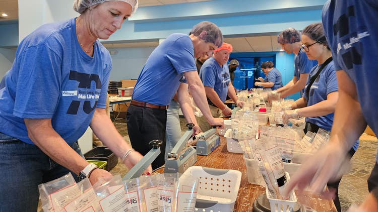 Elanco employees at meal packing event