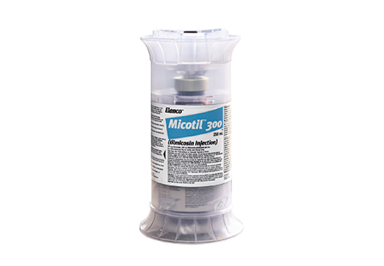 Elanco Micotil 300 (tilmicosin injection) vial inside a clear protective cylindrical case on a white background.