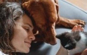 pet owner with dog and kitten thumbnail