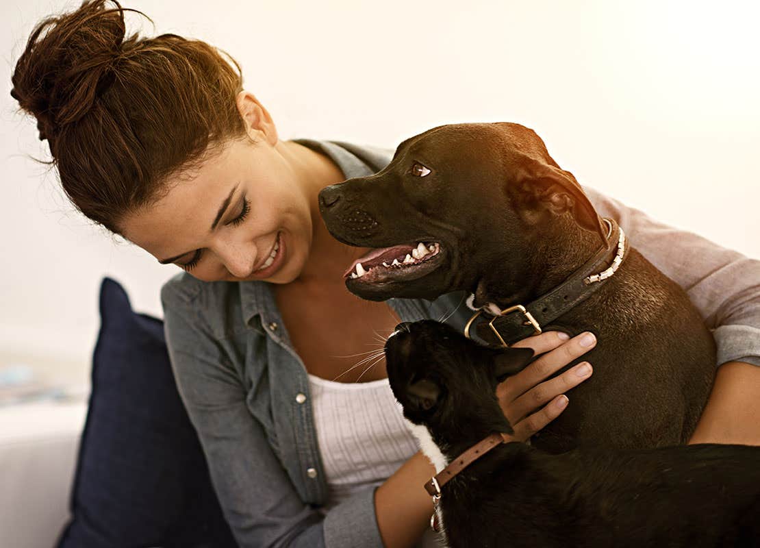 woman with black lab