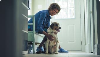 Owner petting dog. 